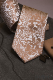 Beżowy krawat z kwiatowym wzorem - szerokość 7,5 cm